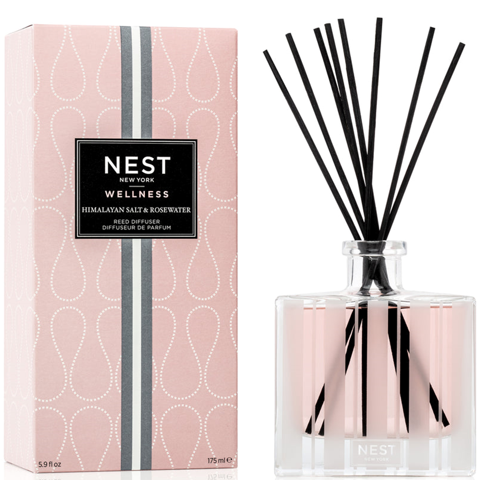 NEST New York wellness reed diffuser with packaging on a white background