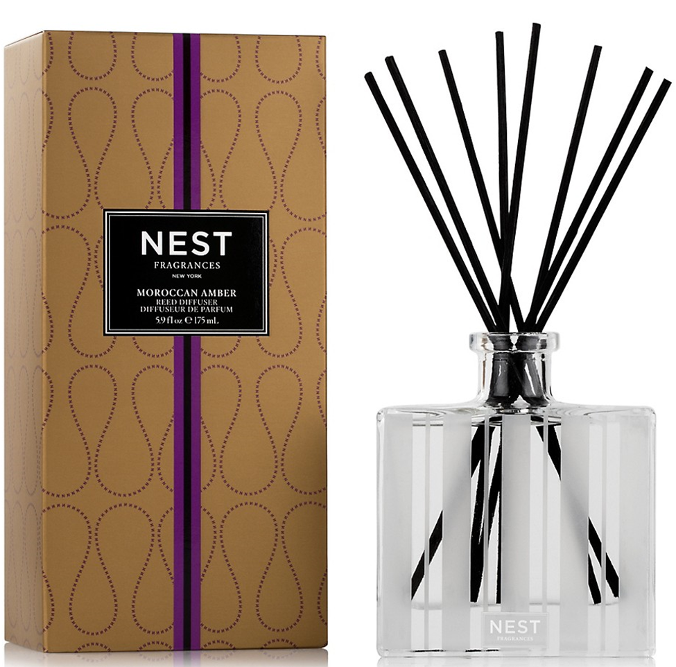 NEST Fragrances diffuser with packaging on a white background