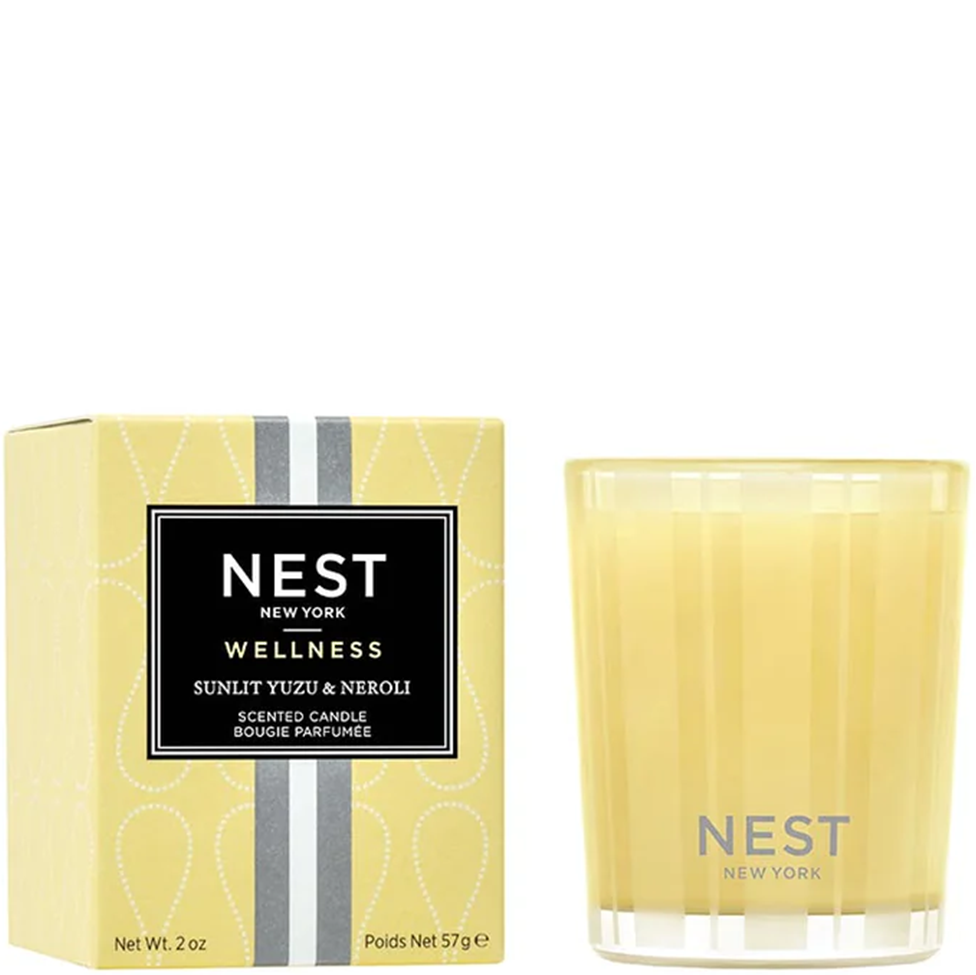 NEST New York wellness candle with packaging on a white background