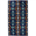 Colorful patterned rug with geometric design on a white background