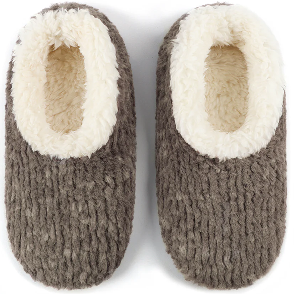 Pair of brown knit slippers with white fuzzy lining on a white background
