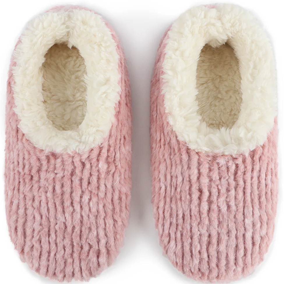 Pair of pink slippers with white interior on a white background