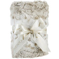 Fluffy blanket with a decorative bow on a white background