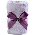 White plush blanket with a purple ribbon and 'Sonoma' branding on a white background