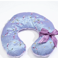Floral-patterned neck pillow with a ribbon on a white background
