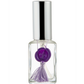 Small clear bottle with a silver cap and purple decorative element on a white background