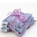 Stack of lavender bags with a pink ribbon on a white background, featuring the Sonoma Lavender Co. brand.