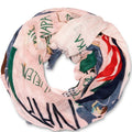Colorful scarf with text and patterns on a white background