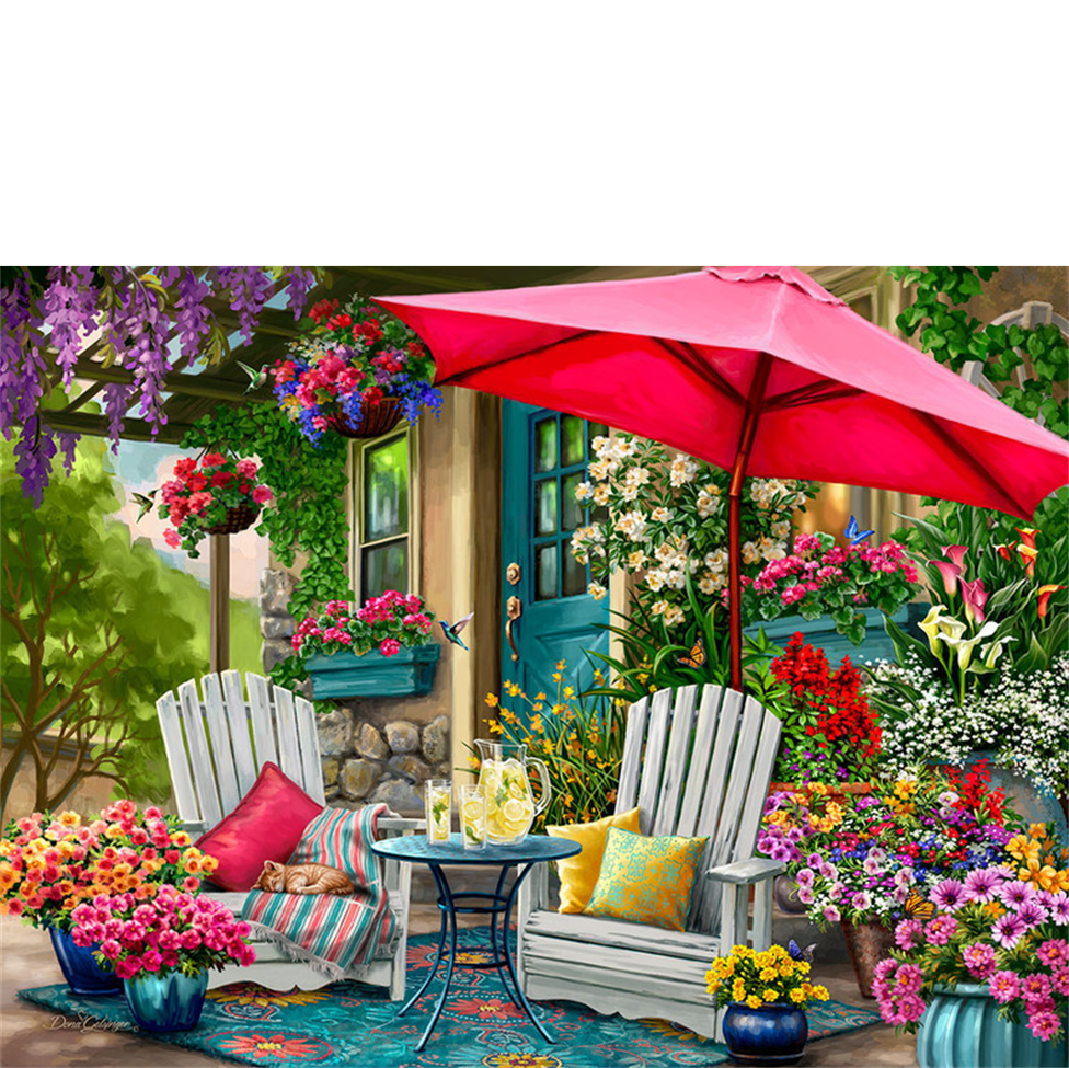 Outdoor seating area with a pink umbrella, chairs, and colorful flowers in a garden setting.