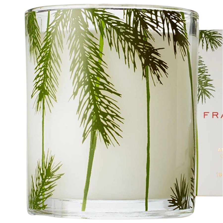 Glass candle with palm tree design on a white background