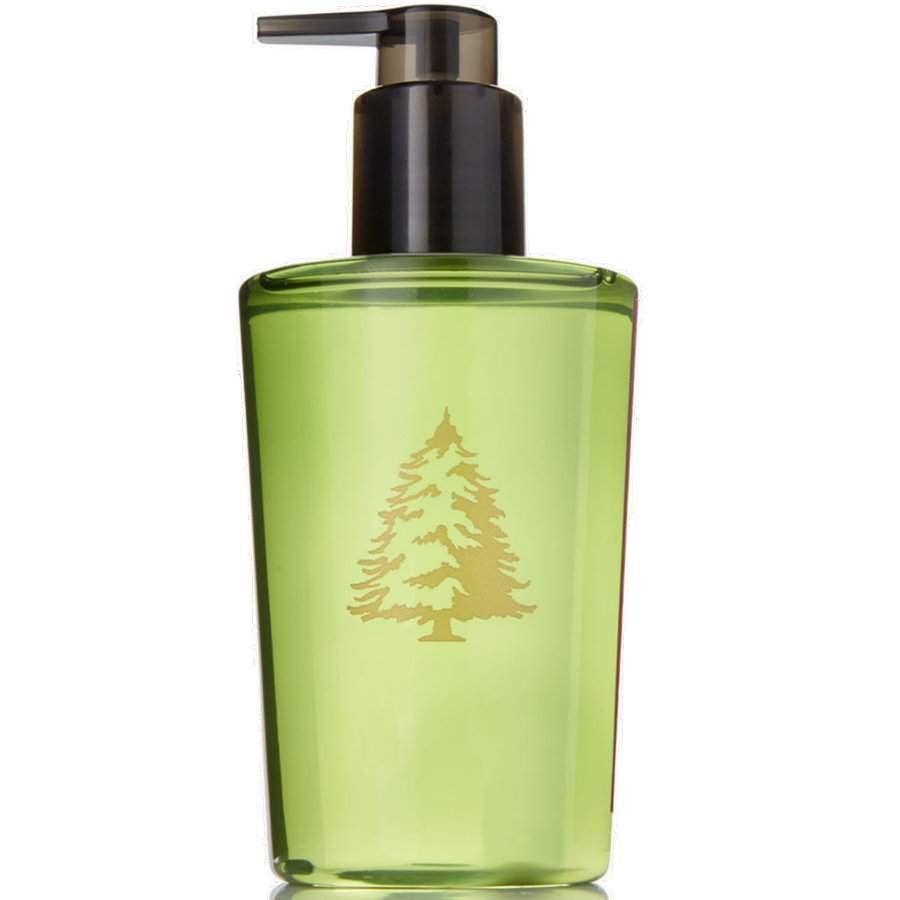 Green bottle with pump and tree design on a white background