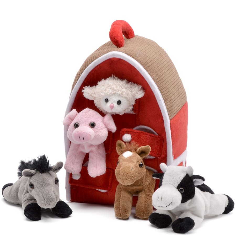 Set of plush farm animals in front of a red barn toy on a white background