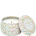 Voluspa candle with colorful lid design on a white background