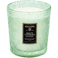 Green textured candle with Voluspa label on a white background