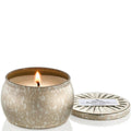 Candle in a decorative pot with a label on a white background