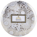Decorative packaging of Voluspa Mokara coconut wax bougie on a white background