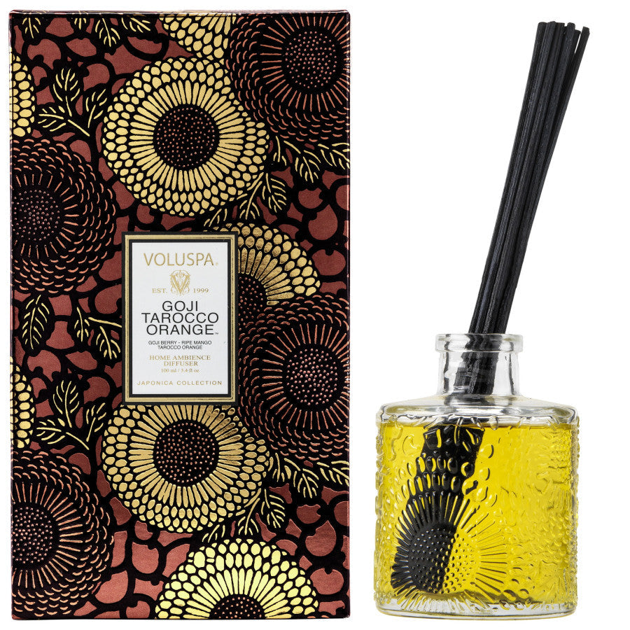 Voluspa diffuser set with decorative box and glass bottle on a white background