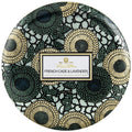 Decorative tin with floral pattern and Voluspa branding on a white background