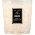 Decorative candle with Voluspa label on a white background