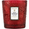 Red embossed candle with Voluspa label on a white background
