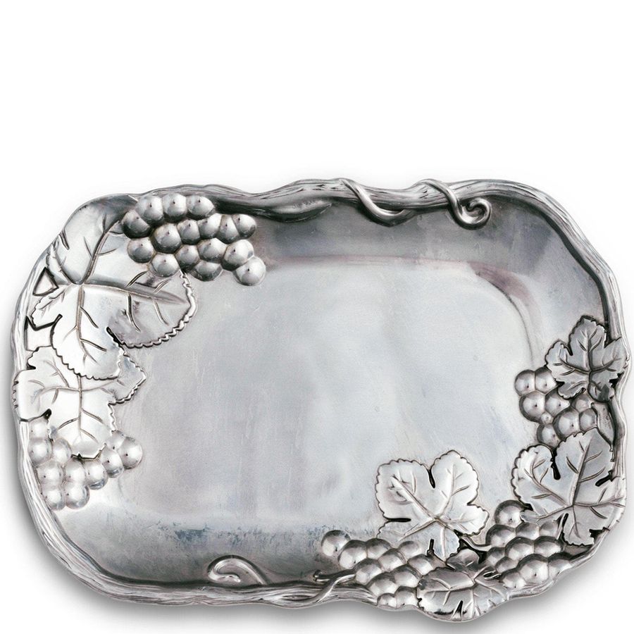 Decorative silver tray with leaf and grapevine designs on a white background