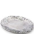 Decorative silver tray with floral patterns on a white background