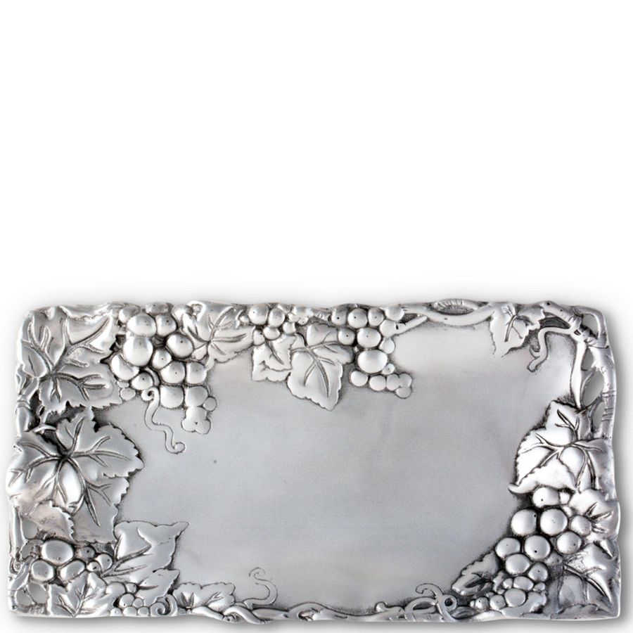 Decorative silver belt buckle with grapevine design on a white background