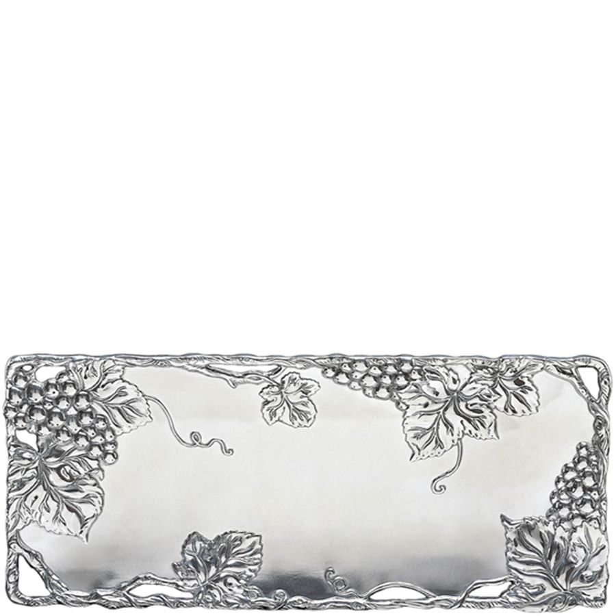 Decorative silver tray with leaf and grapevine patterns on a white background