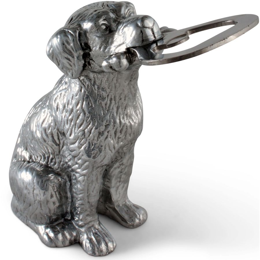 Metallic dog-shaped bottle opener on a white background