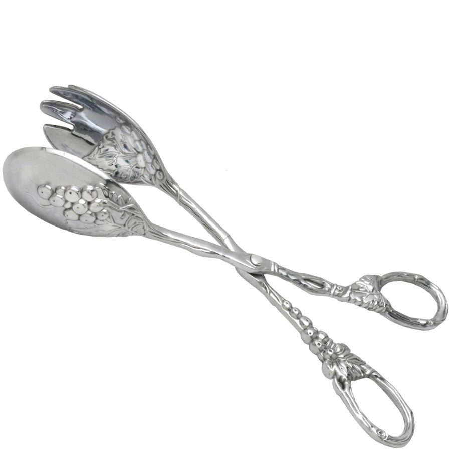 Decorative silver spoons with floral patterns on a white background