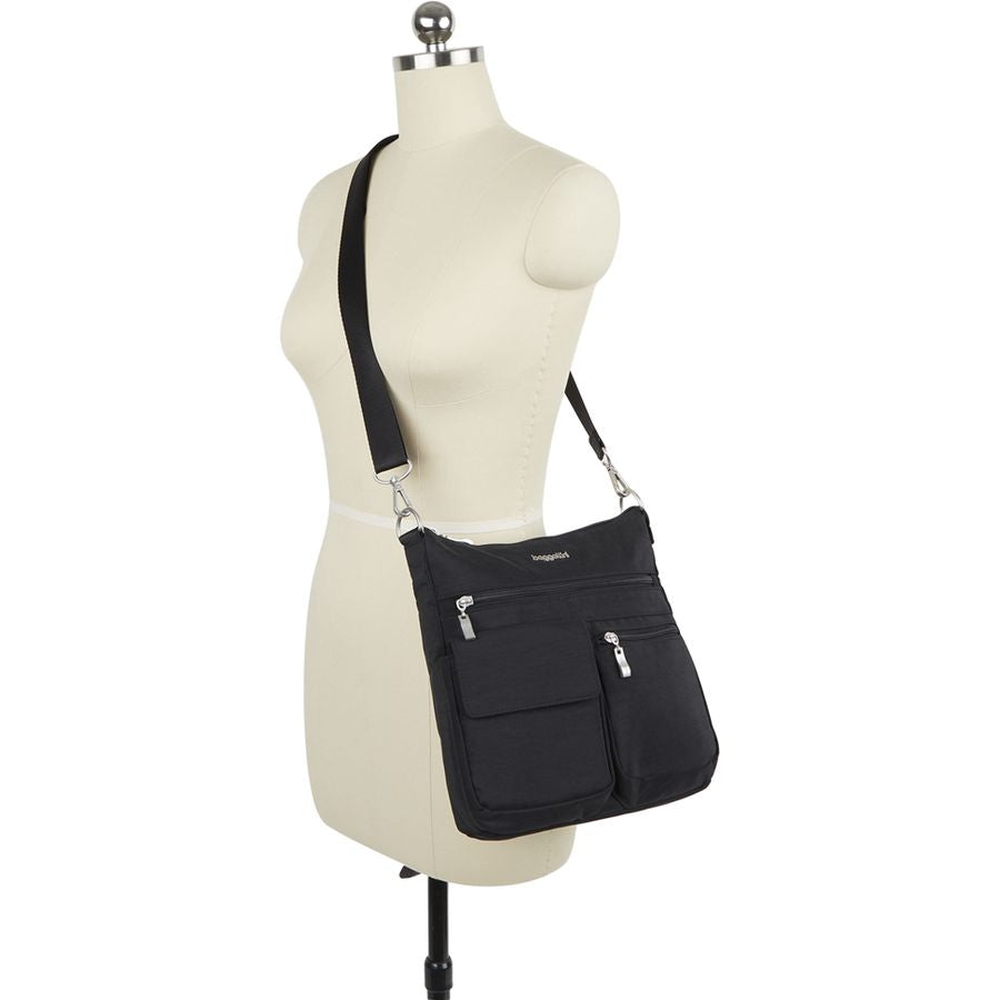 Black shoulder bag on a mannequin with a white background