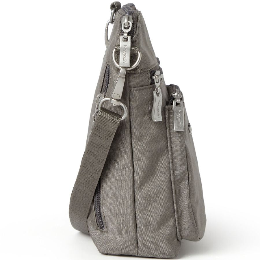 Gray shoulder bag with multiple zippers on a white background