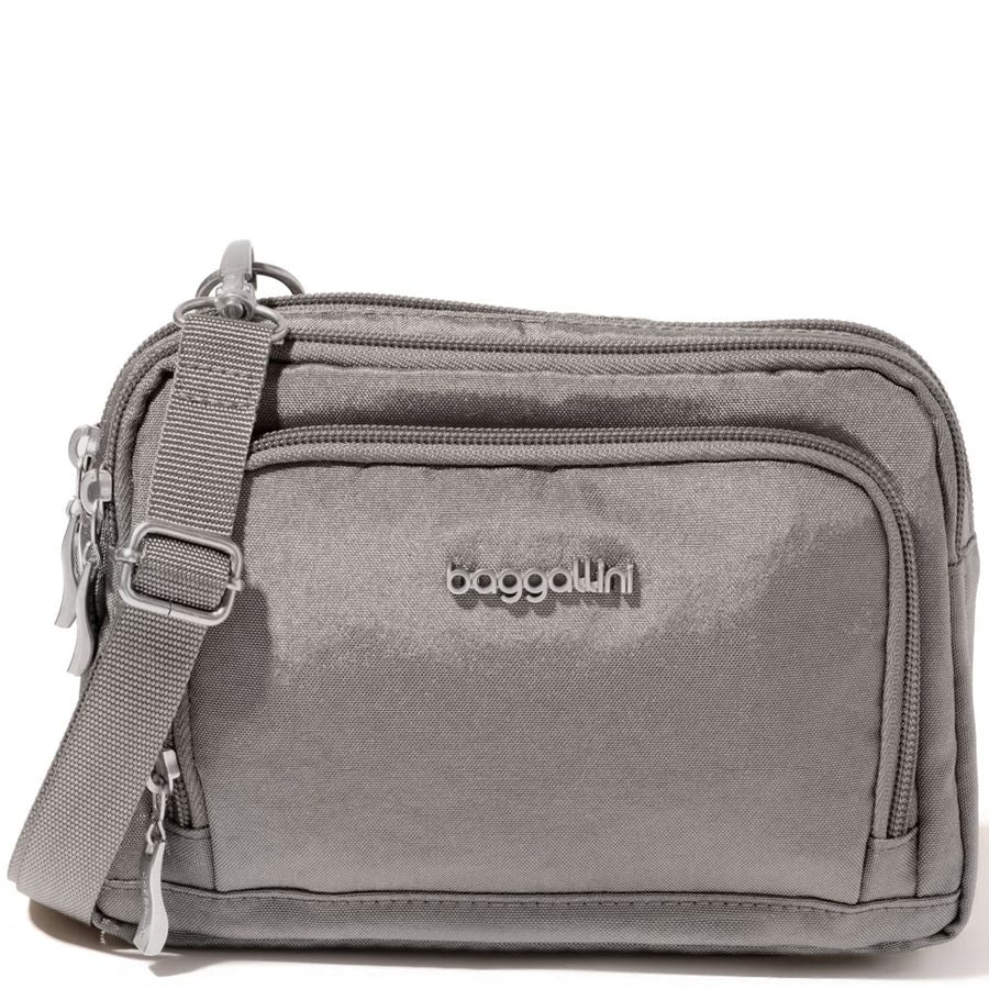 Gray crossbody bag with 'baggallini' logo on a white background