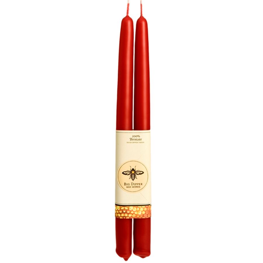 Two red candles with a label featuring a bee emblem on a white background