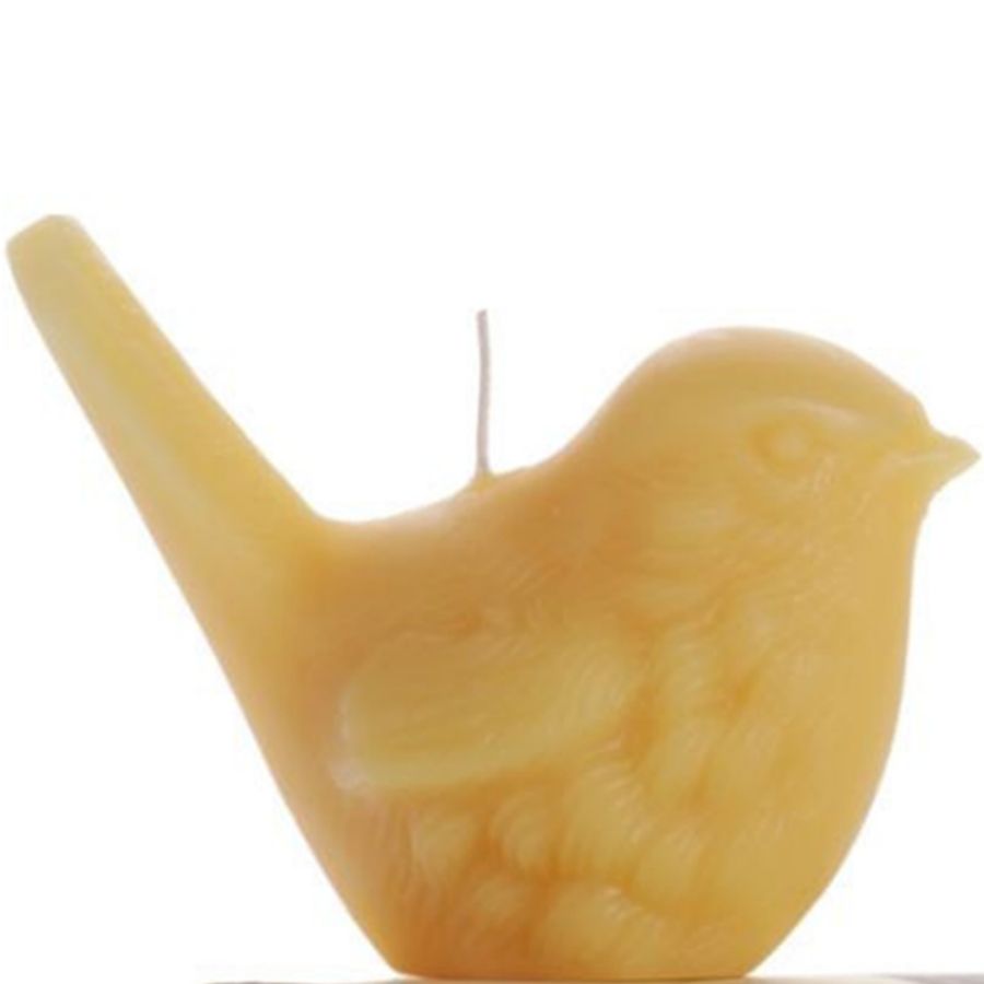 Yellow bird-shaped candle on a white background
