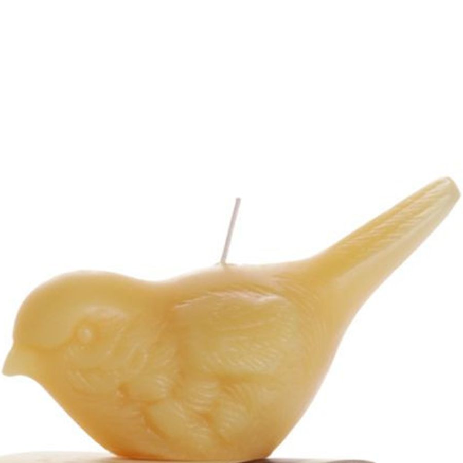 Yellow bird-shaped candle on a white background