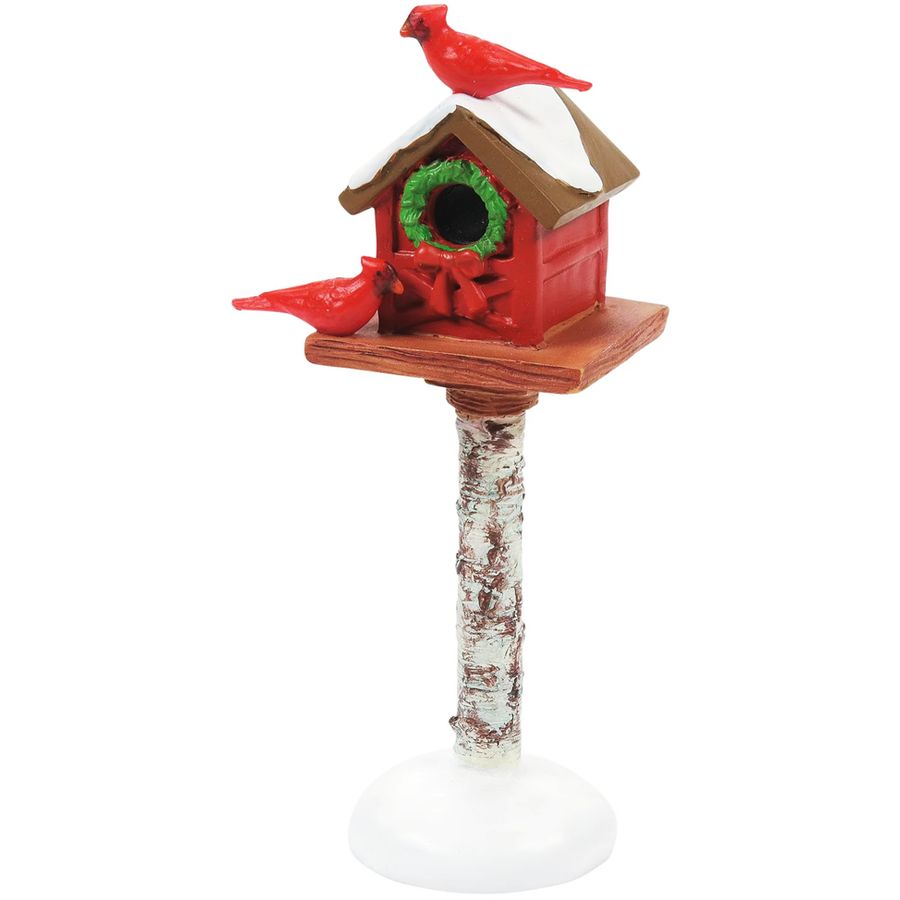 Decorative birdhouse with red cardinals on a white background