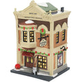 Decorative model of a two-story building with lit windows and festive decorations on a white background.