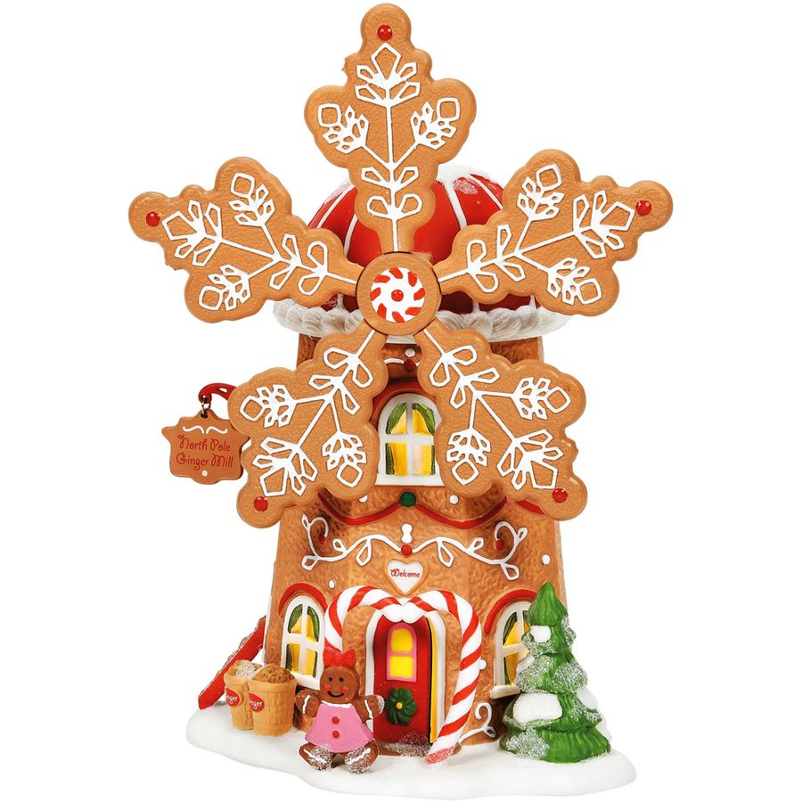 Decorative gingerbread house with candy decorations on a white background