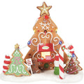 Decorative gingerbread house with candy cane and trees on a white background
