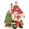 Decorative figurine of a house with a red roof and Christmas tree on a white background