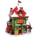 Christmas-themed toy factory set with red and green colors on a white background