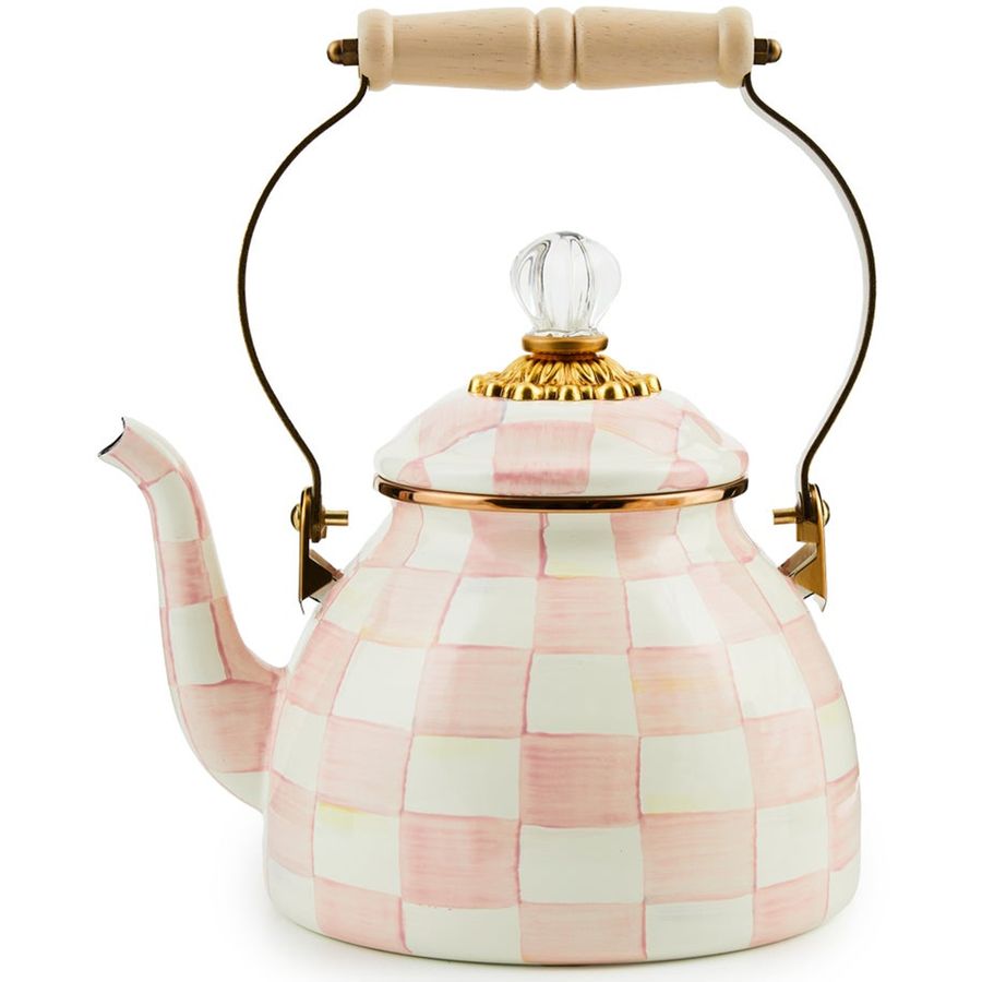 Checkered pink and white teapot with a wooden handle on a white background
