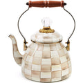 Decorative teapot with checkered pattern and wooden handle on a white background