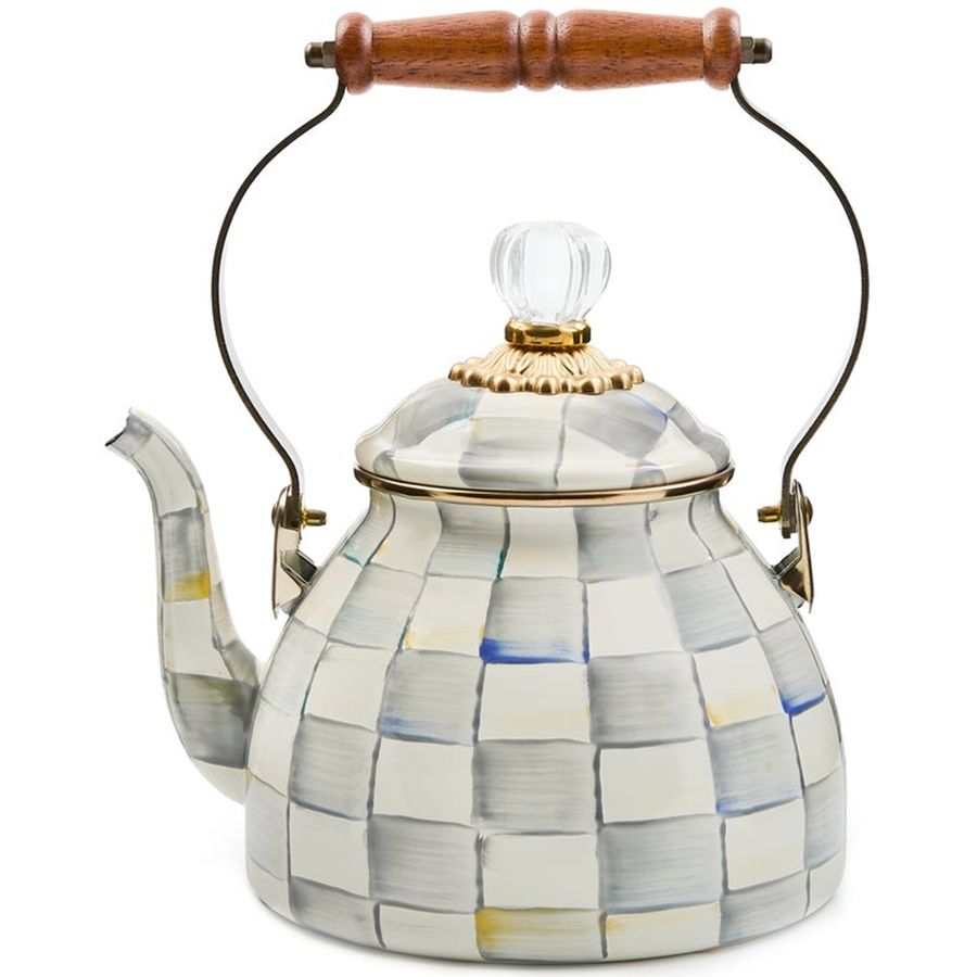 Decorative teapot with checkered pattern and wooden handle on a white background