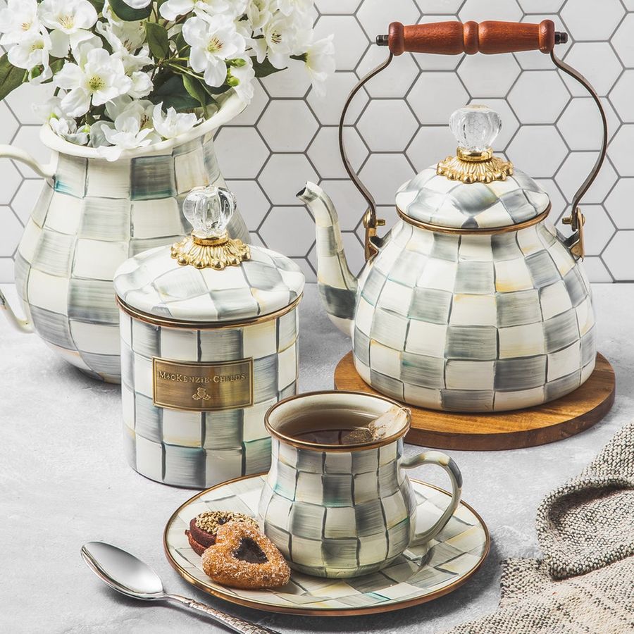 Tea set with checkered design on a light background
