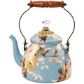 Floral-patterned teapot with wooden handle on a white background