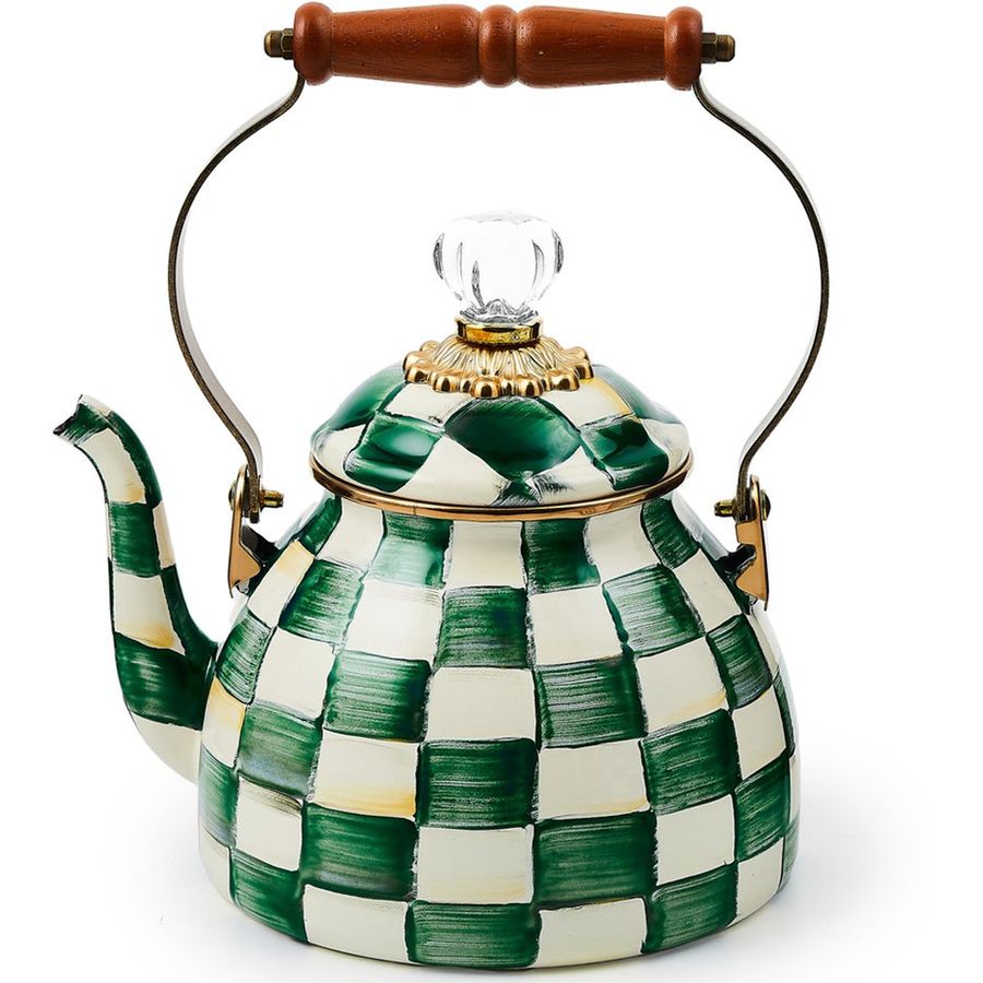 Decorative teapot with green and white checkered pattern on a white background