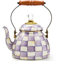 Checkered teapot with wooden handle on a white background