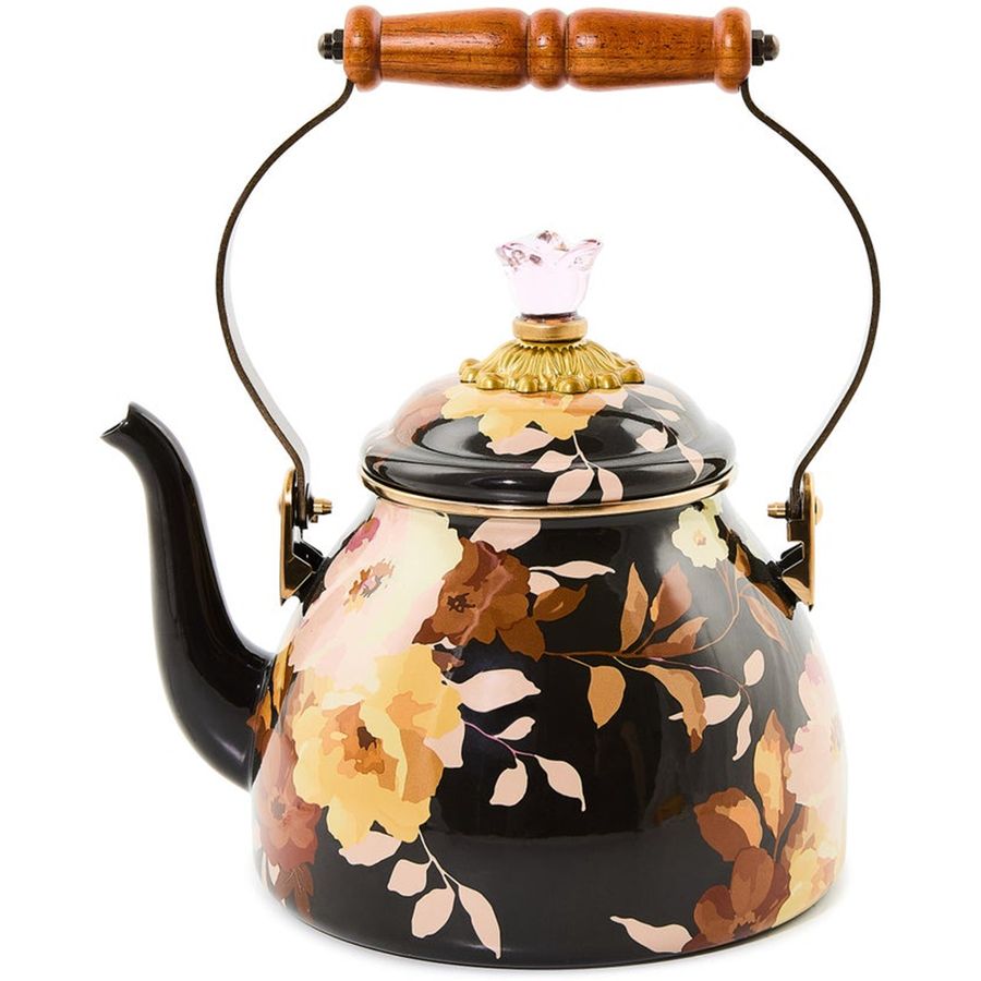 Floral-patterned teapot with wooden handle on a white background